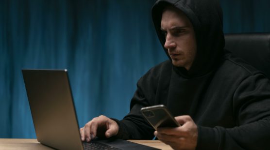 concerned-man-with-devices-medium-shot